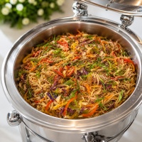 Mozaic Asian-style noodles with colorful vegetables and sesame garnish